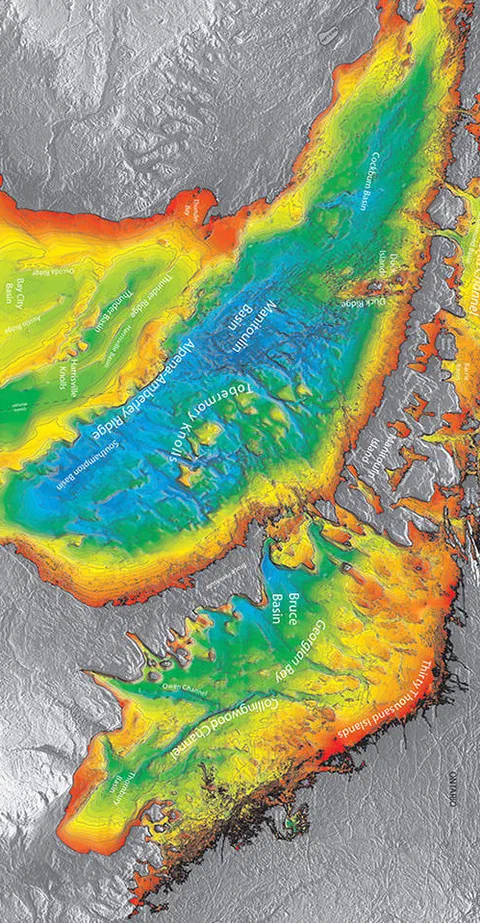 Color shaded-relief bathymetry of a coastal seafloor, with deep blues in the channel and reds on the shallow banks